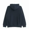The back view of a plain black hoodie on a hanger, highlighting the smooth fabric and raglan sleeve design.