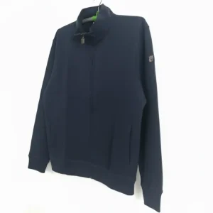 A navy blue full-zip jacket with a high stand collar, ribbed cuffs, and a small square patch logo on the upper left sleeve, photographed on a hanger.