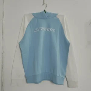 A light blue and white color block pullover hoodie by Kappa, featuring a large white logo and raglan sleeves, photographed on a hanger.