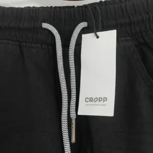 Image of CROPP black jogger pants with elastic waist, folded and showing the size 36 JOGGER tag.