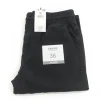 Image of CROPP black jogger pants with elastic waist, folded and showing the size 36 JOGGER tag.