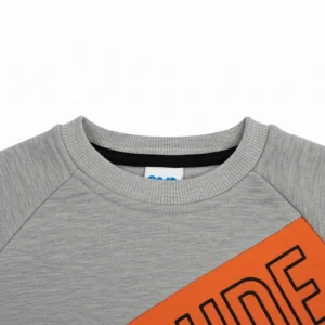 Front view of a grey, orange, and black long-sleeve kids' sweatshirt with a diagonal orange block that reads 