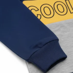 Front view of a navy blue, yellow, and grey long-sleeve kids' sweatshirt with a diagonal yellow block that reads