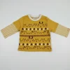 Front view of a mustard yellow toddler long-sleeve T-shirt with a white collar, featuring rows of bears, reindeer, snowmen, and trees print, and yellow-and-white striped sleeves with a layered look.