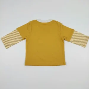 Back view of a plain mustard yellow long-sleeve toddler T-shirt with a white collar and snap buttons at the neck.