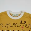 Front view of a mustard yellow toddler long-sleeve T-shirt with a white collar, featuring rows of bears, reindeer, snowmen, and trees print, and yellow-and-white striped sleeves with a layered look.