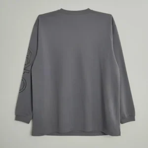 men’s charcoal gray long-sleeve crew neck t-shirt featuring a small black chest graphic and printed branding on the left sleeve.