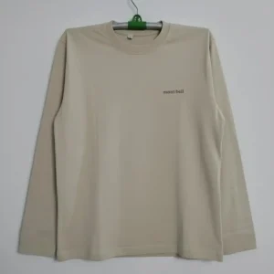 Beige men’s long-sleeve crew neck t-shirt featuring a small mont-bell logo on the chest, displayed on a plain background.