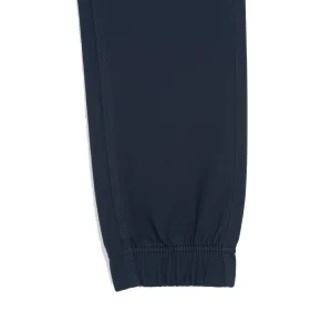 Front view of dark navy blue tapered joggers/chinos showing the drawstring waist and slanted side pockets.