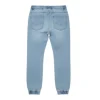 Full product shot of CROPP light blue denim joggers with drawstring waist and cuffed ankles, shown hanging.