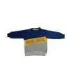 Front view of a navy blue, yellow, and grey long-sleeve kids' sweatshirt with a diagonal yellow block that reads "COOL DUDE."