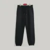 Front view of black joggers/sweatpants showing the adjustable drawstring waist and side pockets.