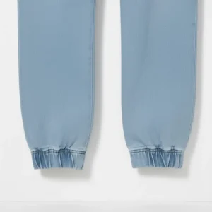 Image of CROPP light blue denim joggers with elastic waist and cuffed ankles, folded